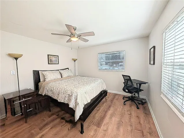 a view of a workspace with furniture and a chandelier
