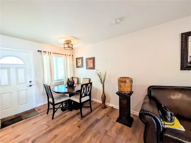 a view of a livingroom with furniture and wooden floor
