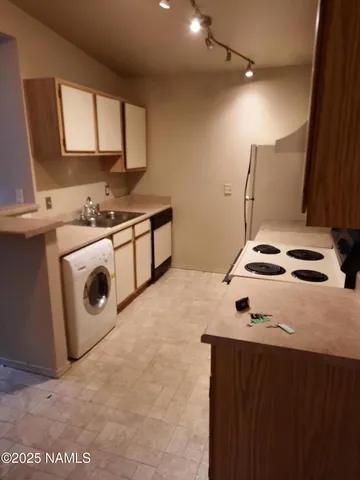 a kitchen with a stove and a microwave