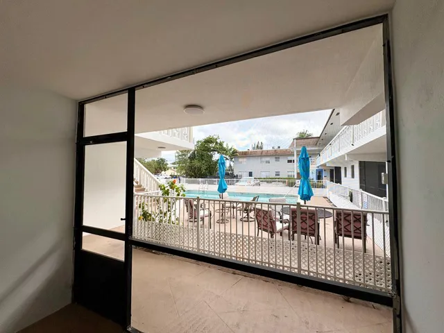 a view of a porch with wooden floor