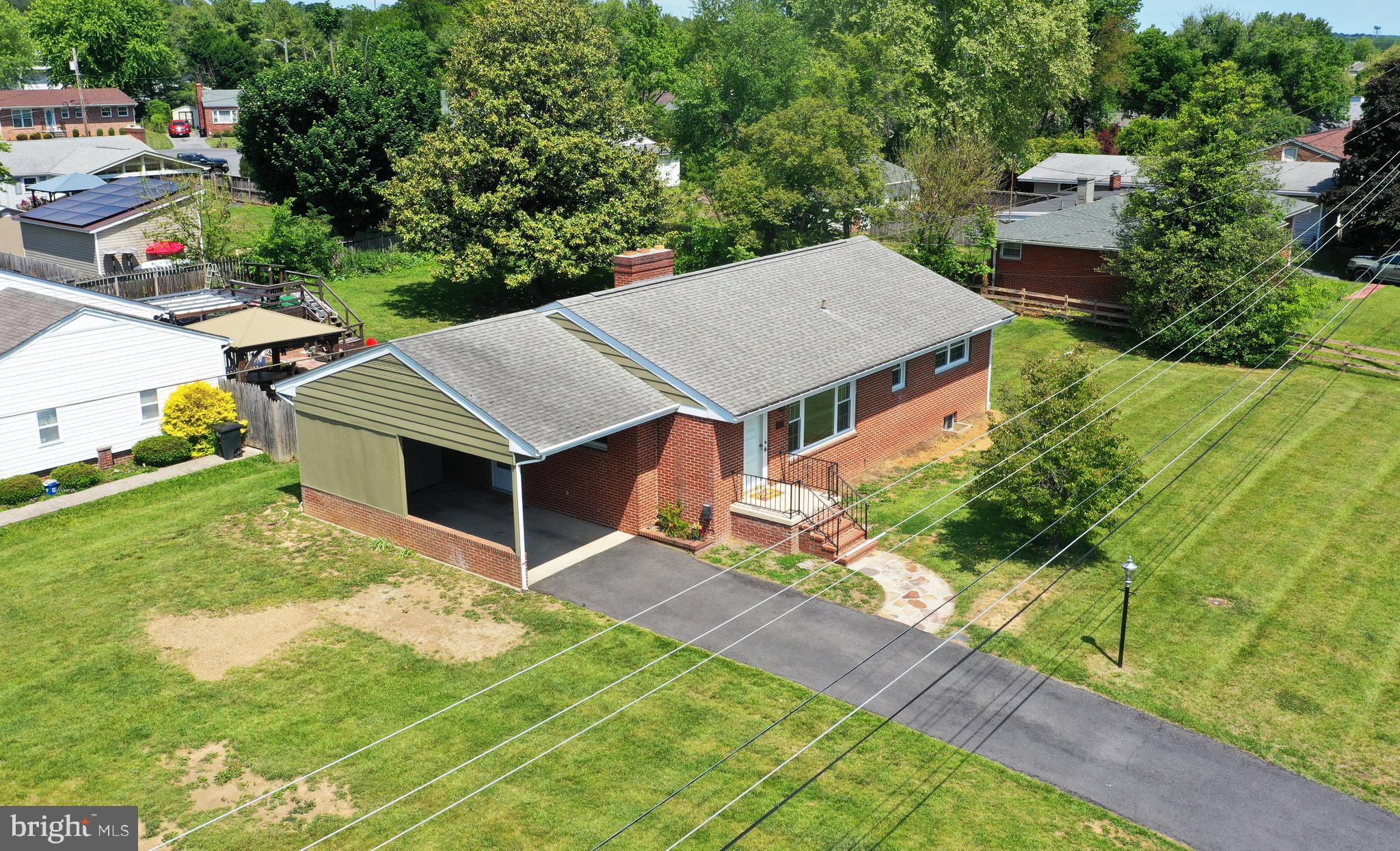 437 Beechcroft Road Winchester, VA 22601 - Photo 47 of 52 a view of a house with a yard and potted plants