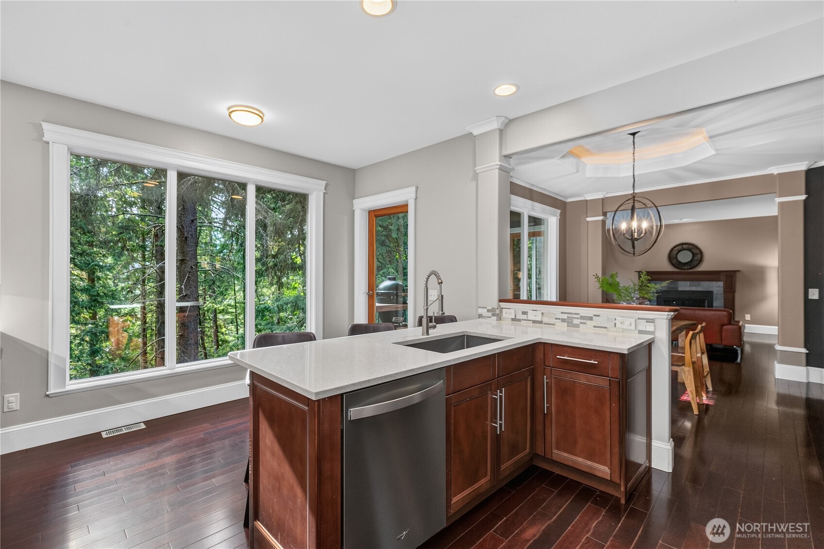 45 Cascade Lane Bellingham, WA 98229 - Photo 10 of 40 a open kitchen with a sink and wooden floor
