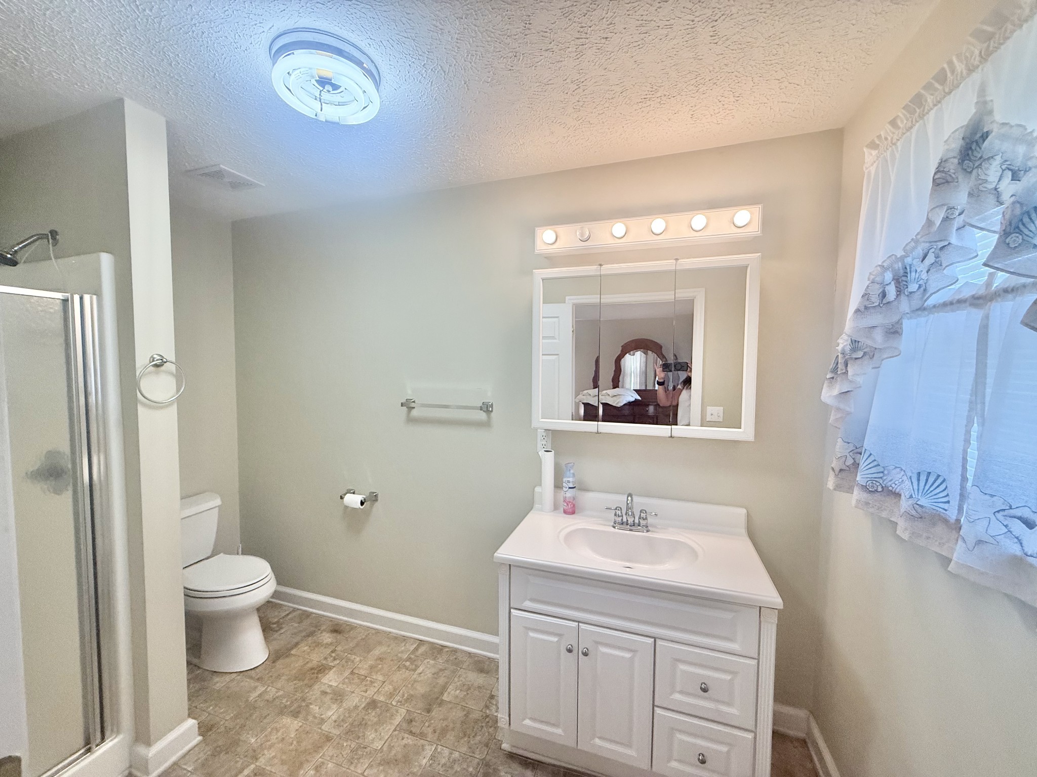 3065 Bucksnort Ridge Road Collinwood, TN 38450 - Photo 6 of 12 a bathroom with a granite countertop sink a toilet and a mirror