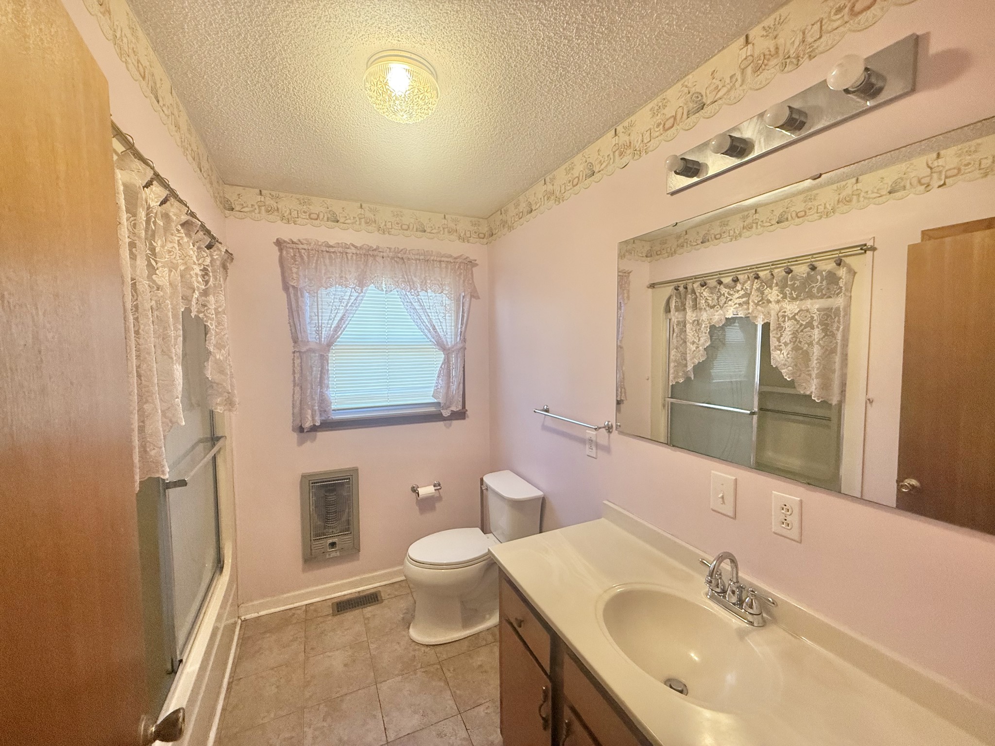 3065 Bucksnort Ridge Road Collinwood, TN 38450 - Photo 8 of 12 a bathroom with a sink a toilet and shower