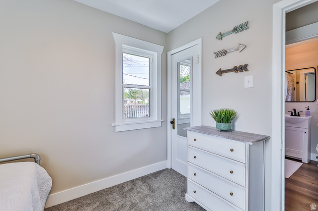 59 East 8680th Street South Sandy, UT 84070 - Photo 14 of 33 Light-toned walls with white trim, a single window, and plush gray carpeting