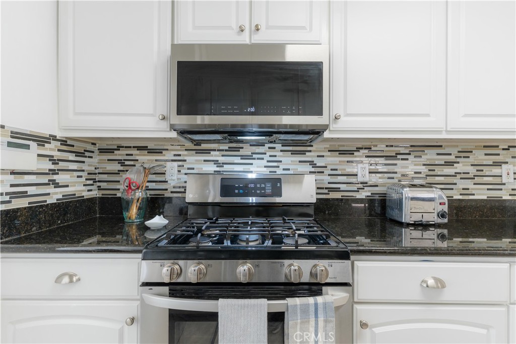 4743 Coldbrook Avenue Lakewood, CA 90713 - Photo 13 of 39 a stove top oven sitting inside of a kitchen