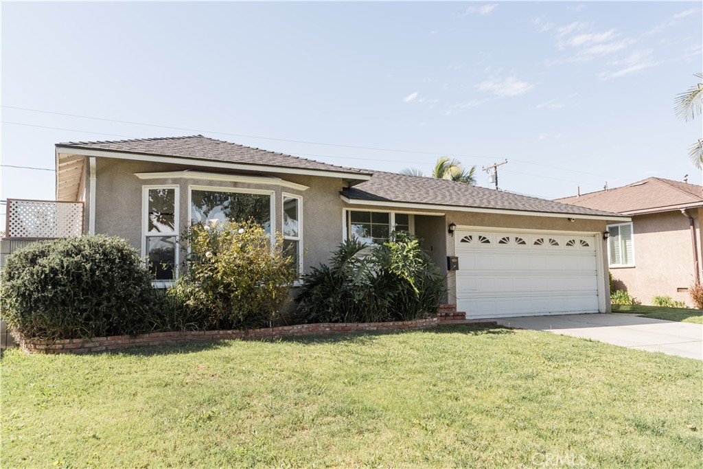 4743 Coldbrook Avenue Lakewood, CA 90713 - Photo 2 of 39 a front view of house with yard and garage