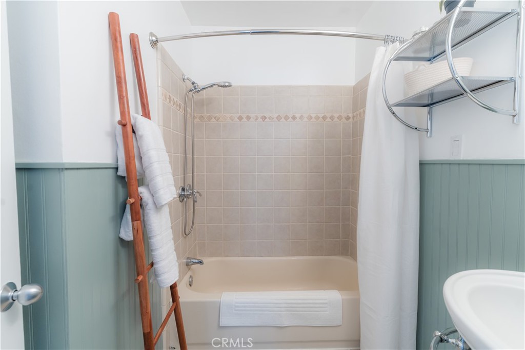 4743 Coldbrook Avenue Lakewood, CA 90713 - Photo 22 of 39 a bathroom with a shower and a tub