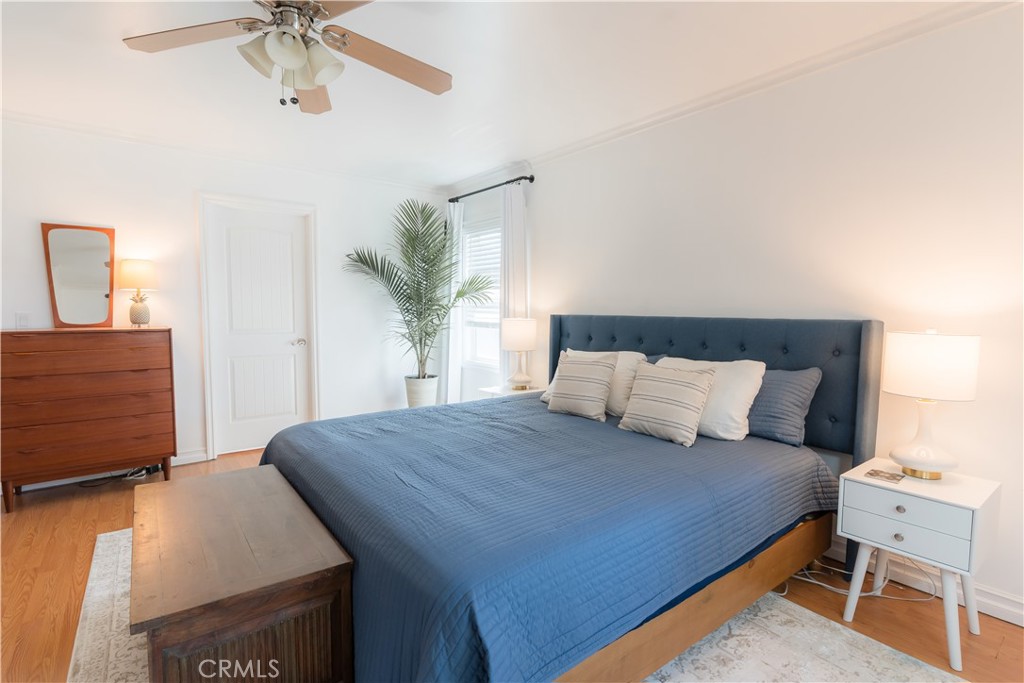 4743 Coldbrook Avenue Lakewood, CA 90713 - Photo 27 of 39 a bedroom with a large bed and a chandelier