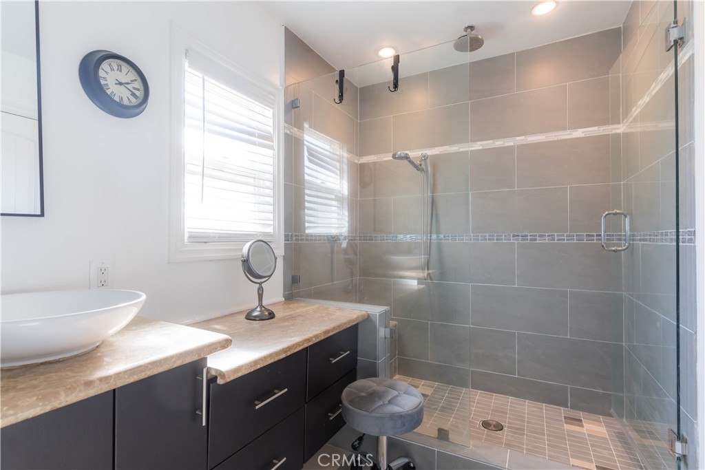 4743 Coldbrook Avenue Lakewood, CA 90713 - Photo 31 of 39 a bathroom with a sink a toilet and a shower