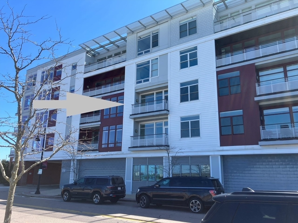 23 Shipyard Drive, Unit 303 Hingham, MA 02043 - Photo 3 of 13 a car parked in front of a building