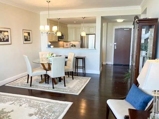 23 Shipyard Drive, Unit 303 Hingham, MA 02043 - Photo 4 of 13 a view of a dining room with furniture