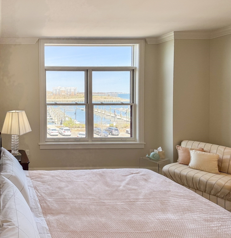 23 Shipyard Drive, Unit 303 Hingham, MA 02043 - Photo 9 of 13 a bedroom with a bed and a window