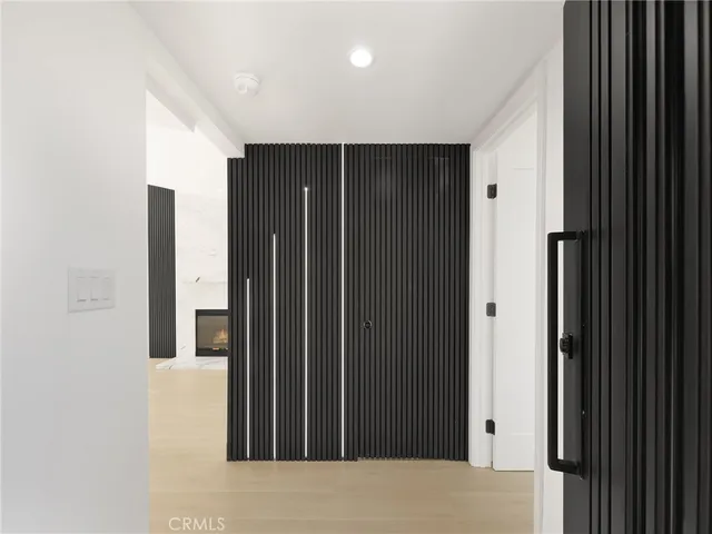 a view of gallery with wooden floor