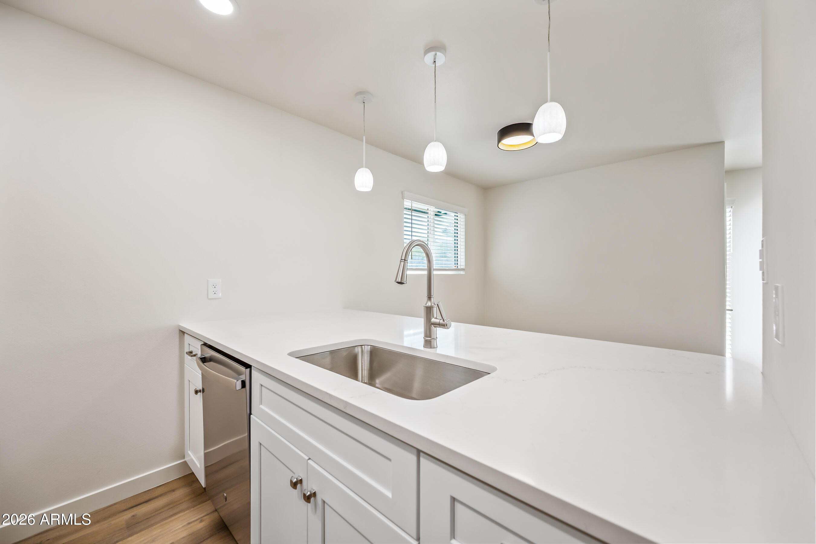 4139 North 27th Street, Unit 3 Phoenix, AZ 85016 - Photo 12 of 30 a kitchen with a sink and cabinets