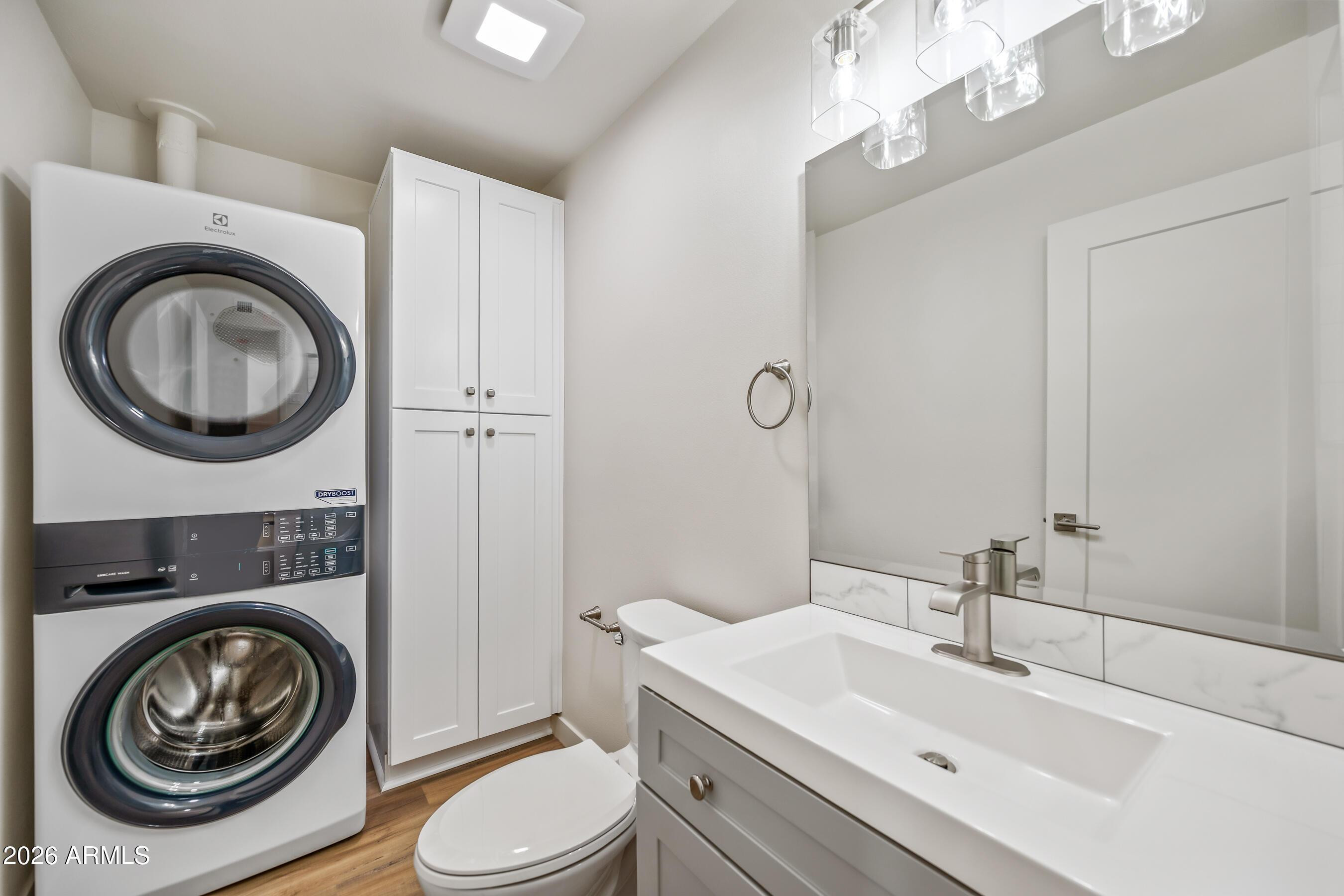 4139 North 27th Street, Unit 3 Phoenix, AZ 85016 - Photo 16 of 30 a bathroom with a sink a washer and dryer