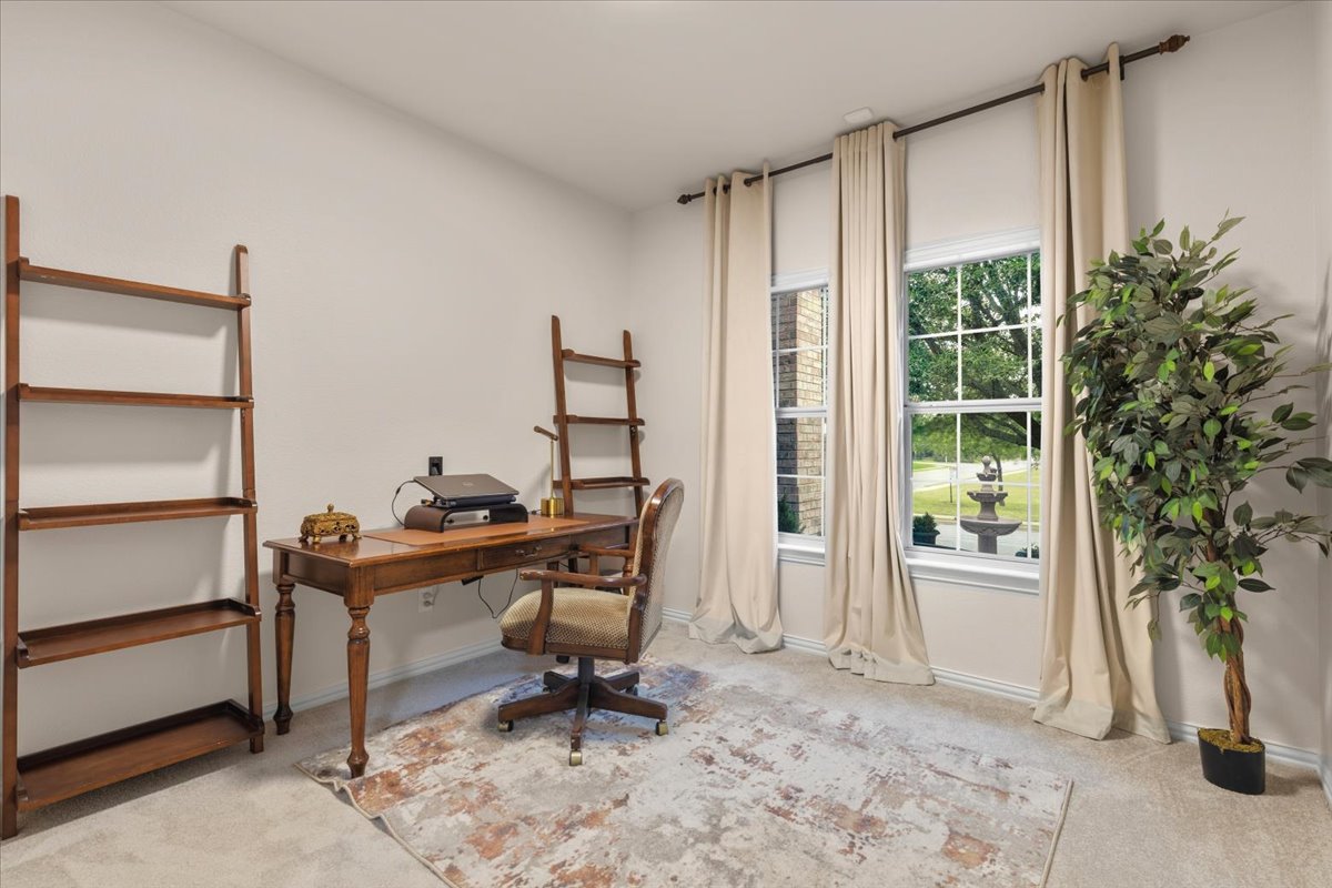 2501 Aspen Meadow Road Leander, TX 78641 - Photo 20 of 30 Carpeted room with neutral wall tones and two large windows offering natural light