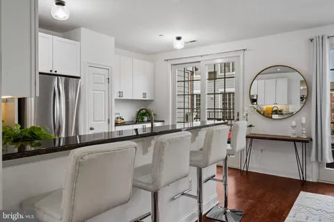 a kitchen with stainless steel appliances a refrigerator stove microwave and cabinets