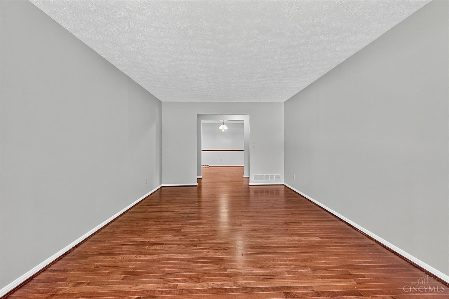 2086 Resor Road Fairfield, OH 45014 - Photo 17 of 42 Reverse view highlights the length and flexibility of the hardwood-floored living space.