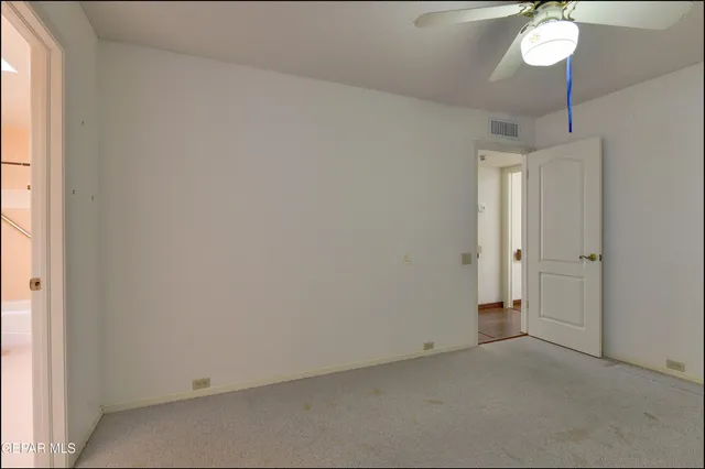 an aerial view of a house with garden space and street view