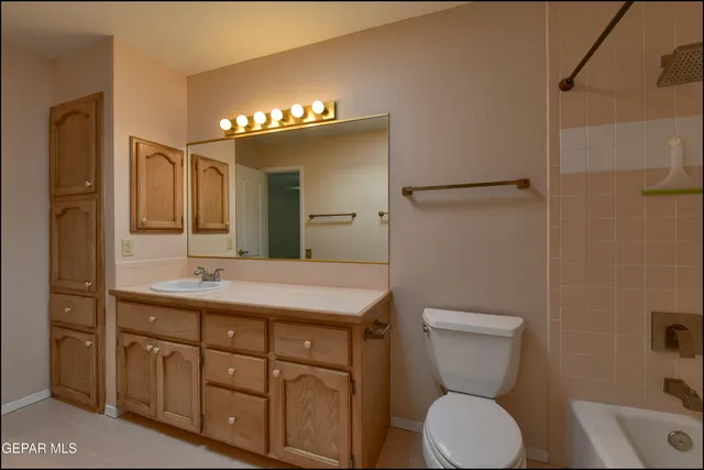 an aerial view of a house with a yard and potted plants