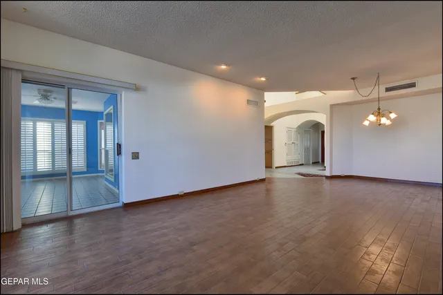 a kitchen with stainless steel appliances granite countertop a sink dishwasher a stove top oven a refrigerator with island and chairs