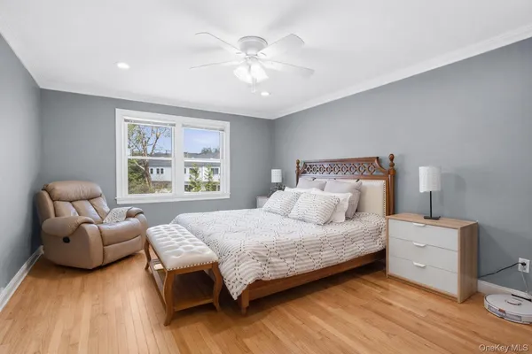 a bedroom with a bed and a couch
