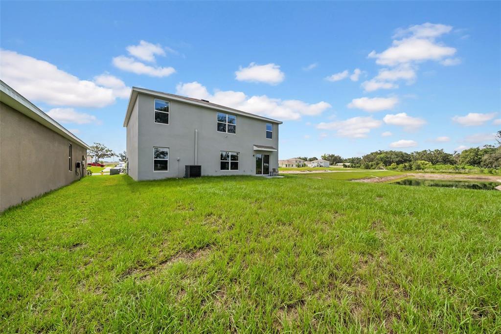 13295 Mylion Way Spring Hill, FL 34610 - Photo 11 of 68 a view of a backyard with plants and a garden