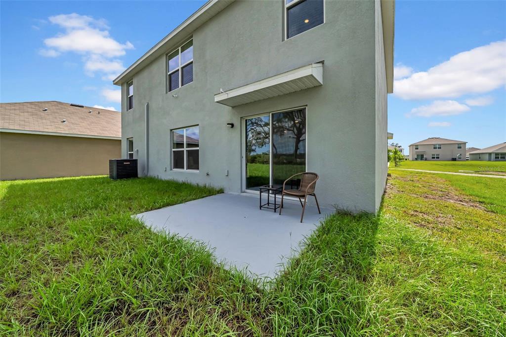 13295 Mylion Way Spring Hill, FL 34610 - Photo 13 of 68 a swimming pool with outdoor seating and yard