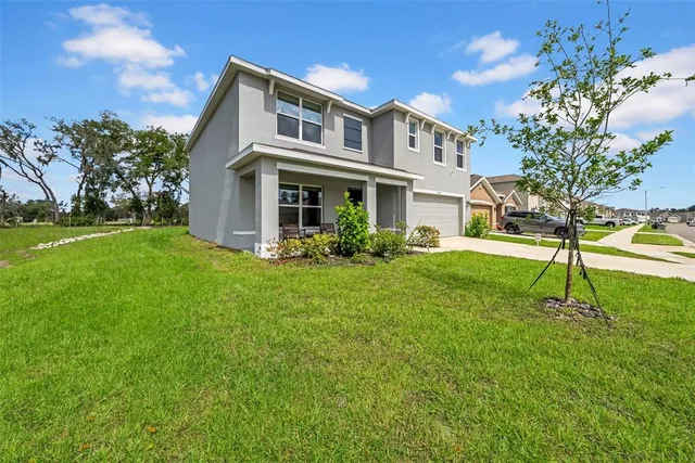a view of a house with a big yard