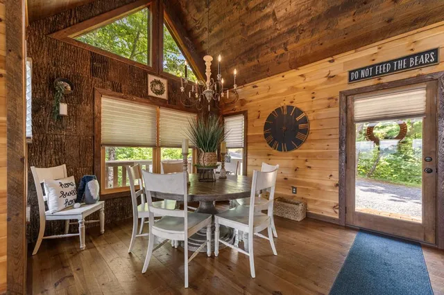 a living room with furniture or wooden floor and a chandelier