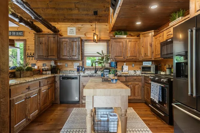 a kitchen with counter top space and stainless steel appliances