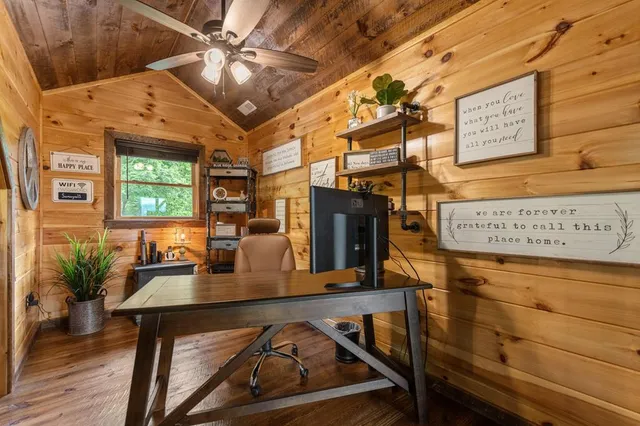 a view of a chairs and table in the balcony