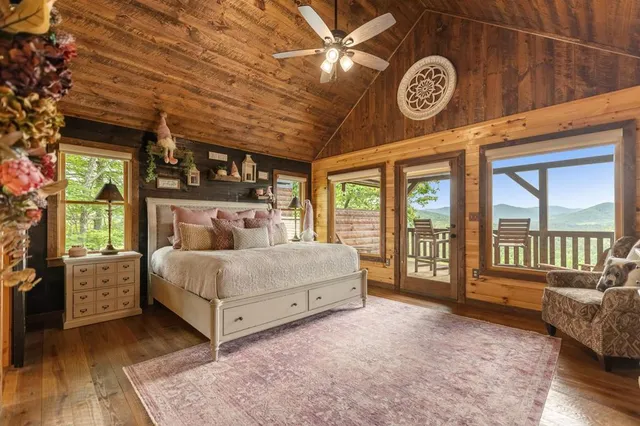 a bathroom with a granite countertop sink a mirror and shower