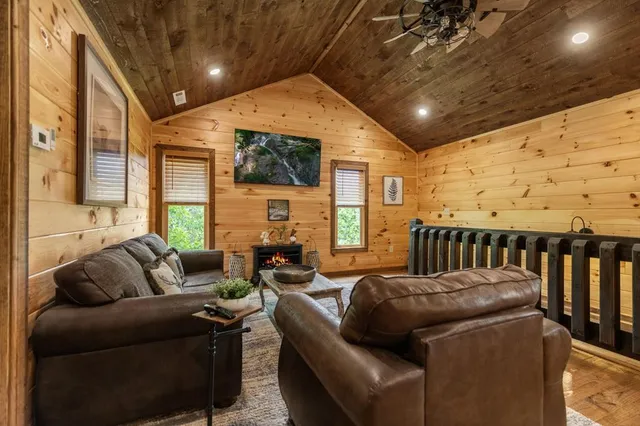 a bed room with a bed and a ceiling fan