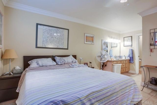 a bedroom with a bed and a table