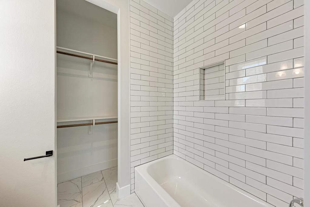 7714 Watson Street, Unit B Austin, TX 78757 - Photo 20 of 40 Tub with subway tile