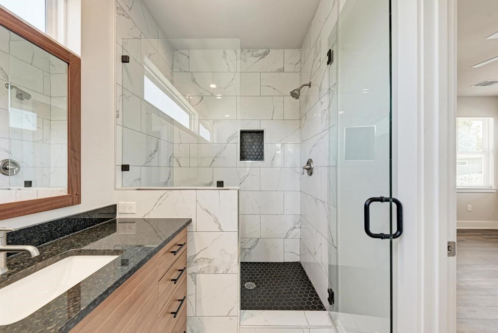 7714 Watson Street, Unit B Austin, TX 78757 - Photo 24 of 40 Standup Shower with marble tiles