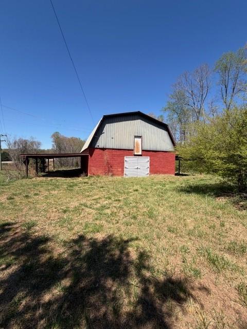 4485 Poplar Springs Road Gainesville, GA 30507 - Photo 4 of 17 a front view of house with yard and swimming pool