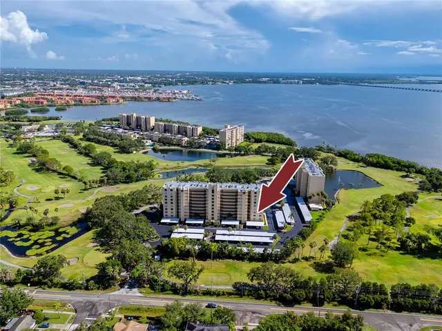 an aerial view of houses with yard