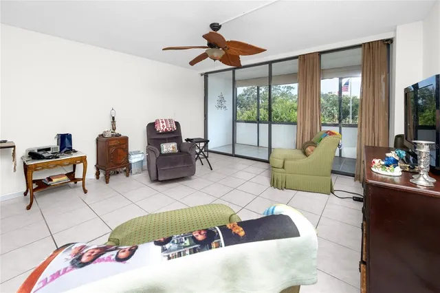 a bedroom with a bed and a dresser next to a window