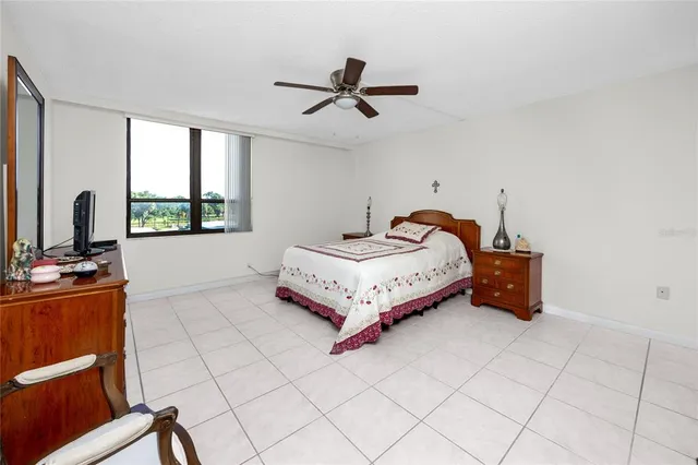 a bedroom with a bed and a table