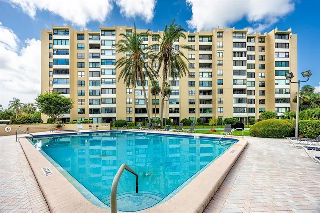 a view of swimming pool with outdoor seating
