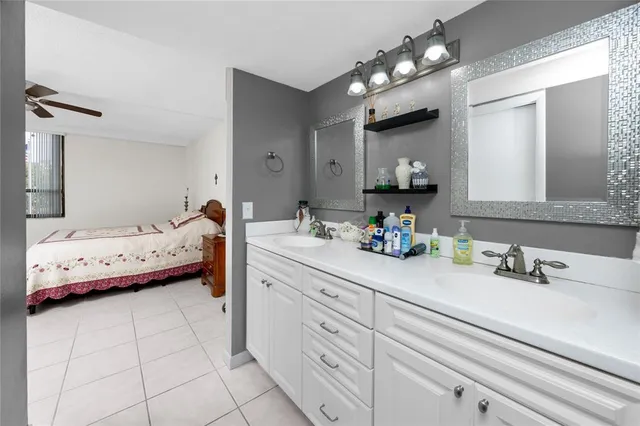 a bathroom with a glass shower door