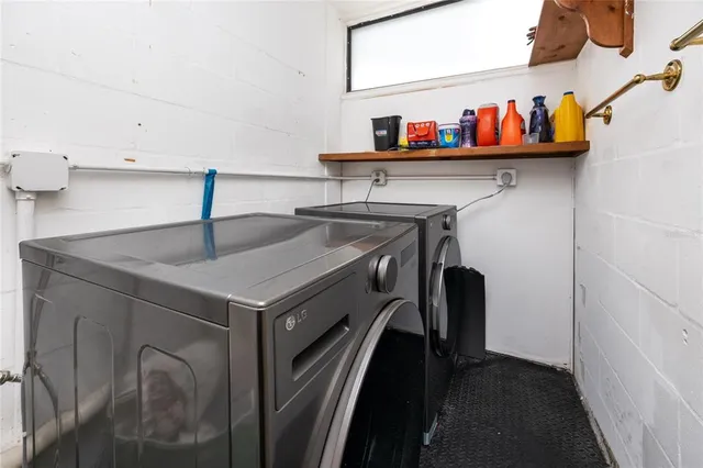 a view of swimming pool with seating space