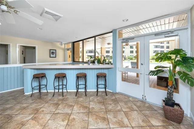 a view of a swimming pool with an outdoor space and seating area