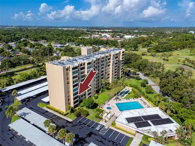 an aerial view of residential house with outdoor space and swimming pool