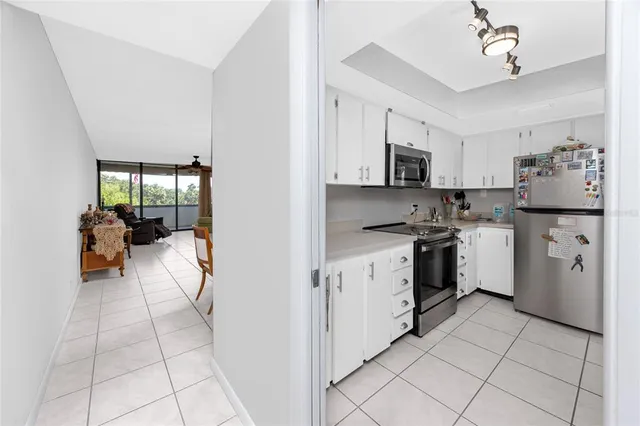 a kitchen with a sink and a refrigerator
