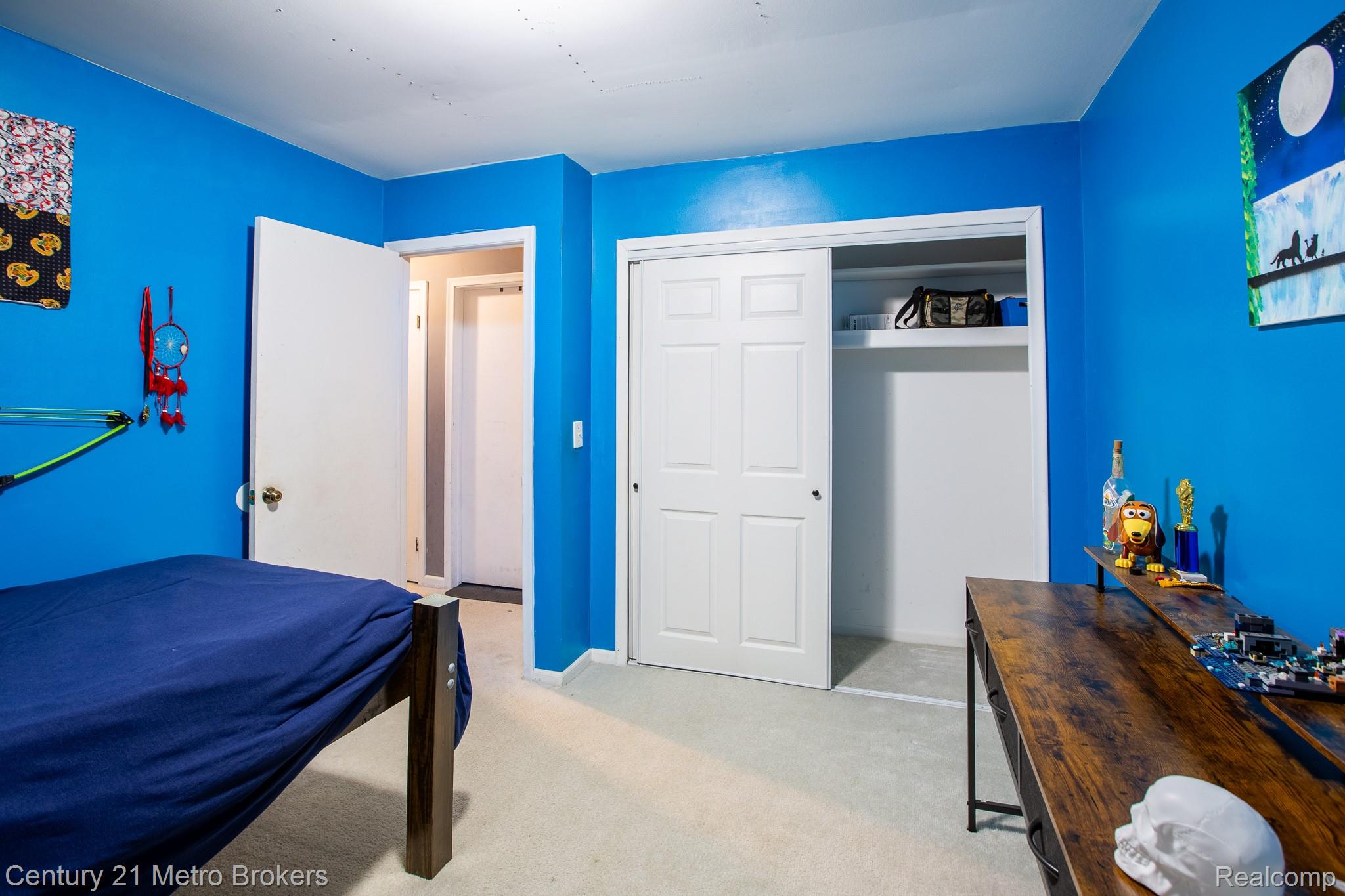 6101 Belsay Road Grand Blanc, MI 48439 - Photo 9 of 28 Bedroom with light colored carpet and a closet