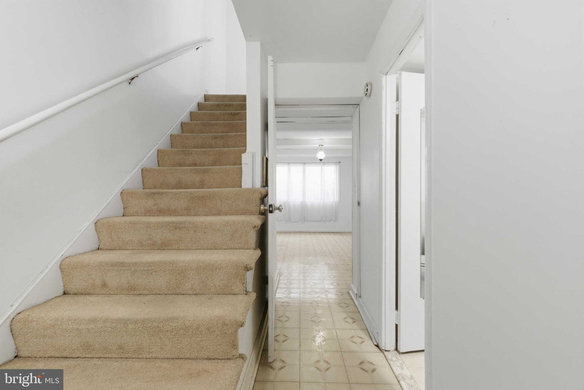 7227 Evanston Road Springfield, VA 22150 - Photo 30 of 44 Inviting staircase leads to bright spaces.